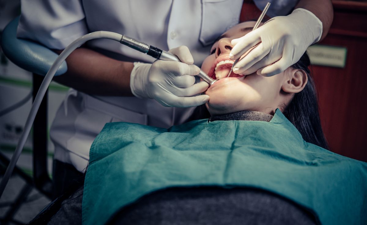 Dentist performing a root canal in Pickering, ON using precision endodontic instruments on a patient